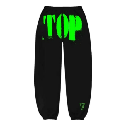 Close-up of Vlone logo on black sweatpants with green top