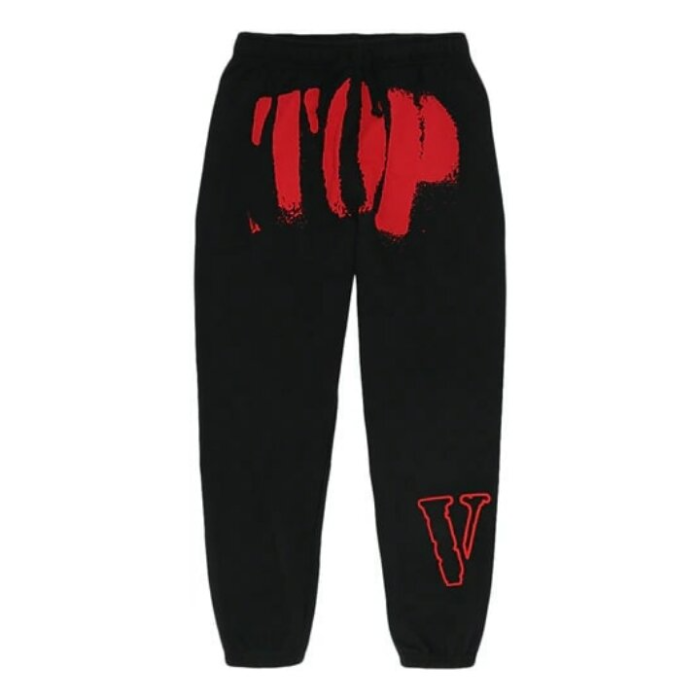 Close-up of Vlone logo on black sweatpants